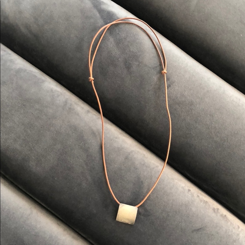 Leather necklace with silver metal charm
